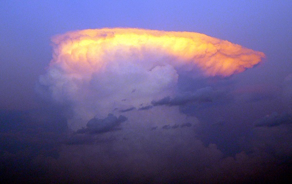  Strong wind shear in the high troposphere forms the anvil-shaped top of this mature cumulonimbus cloud, or thunderstorm. 